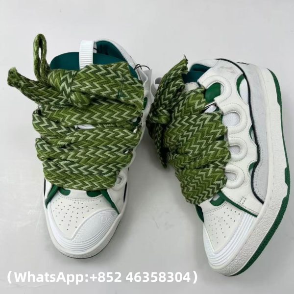 The Curb is a ’90s-inspired sneaker with an assertive design and exaggerated volumes. Made from nappa calfskin, suede and mesh, this elaborately assembled model features ultimate comfort thanks to its round shape, padded tongue and metallic eyelets. Curb leather sneakers Almond toe Waxed and woven double laces with a herringbone motif Quilted tongue with the Lanvin label and an embossed Mother and Child logo