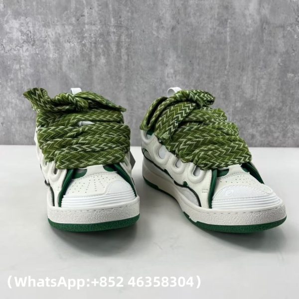 The Curb is a ’90s-inspired sneaker with an assertive design and exaggerated volumes. Made from nappa calfskin, suede and mesh, this elaborately assembled model features ultimate comfort thanks to its round shape, padded tongue and metallic eyelets. Curb leather sneakers Almond toe Waxed and woven double laces with a herringbone motif Quilted tongue with the Lanvin label and an embossed Mother and Child logo